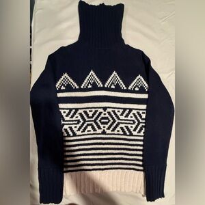 J.Crew turtleneck, navy blue with cream pattern.